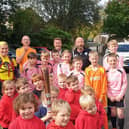 Kettleshulme pupils surround the baton relay team.