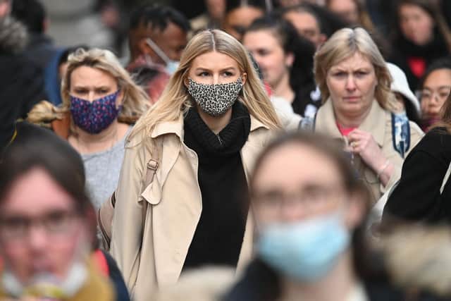 Compulsory mask wearing in shops has been reintroduced by the Government as the Omicron variant of covid spreads rapidly. Photo - Getty.