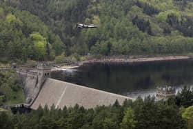 A Lancaster bomber flies over Ladybower reservoir to mark the 70th anniversary of the World War II Dambusters mission on May 16, 2013. (Photo by Christopher Furlong/Getty Images)