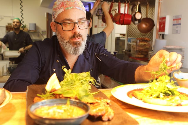 Putting the final touches to a dish at A Tavola restaurant New Mills