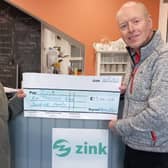Author Julian Cohen donates £1,500 from the sale of his new book, which looks at the history of four shops in the town, to Buxton charity Zink. Photo submitted