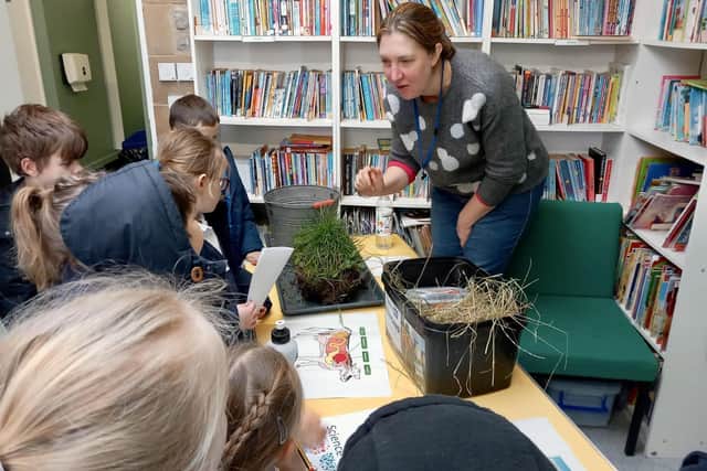 Farmer and government scientist Dr Amy Gyte talks to children about the cycle of nutrition between soil and agriculture.