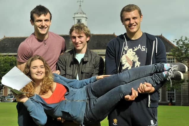 Kings School Macclesfield pupils Jennifer Pinches, from Whaley Bridge, with (left to righ): Jamie Duncan, 18, from Glossop,  Harry Frost and rugby player Ben Marsden, 18, from Buxton, who all celebrated achieving top A Level results. Picture from 2013 taken by Kings School.