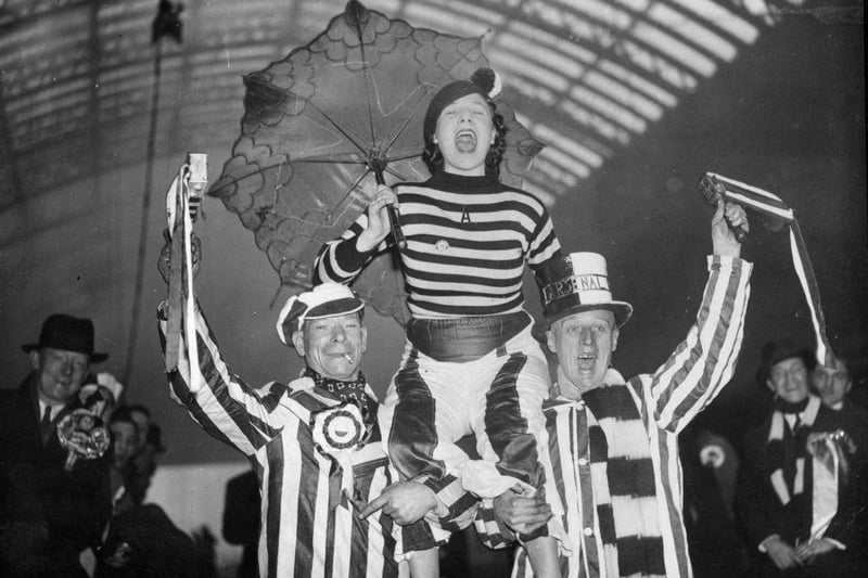 Arsenal football supporters cheer for their team as they make their way to Chesterfield on 16th January 1937.