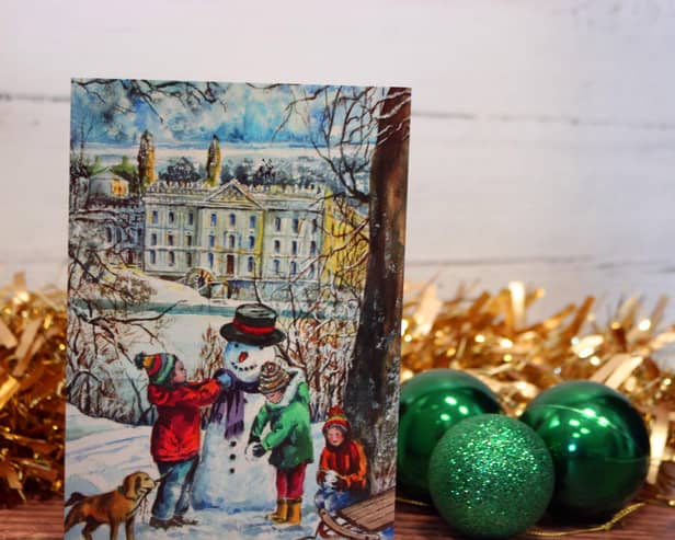 The card depicts children making a snowman in front of Chatsworth House.