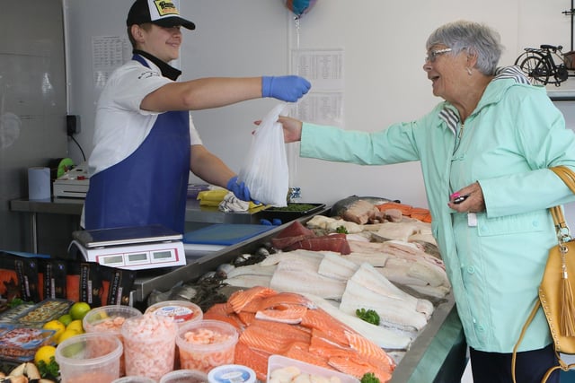 A happy customer shopping at the new fish counter at RGM Seafood. Pic Jason Chadwick