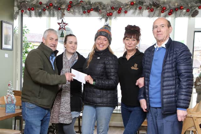 Martin Hoban and Henry Kukiewicz, Master and Secretary of the Phoenix Lodge of St Ann make a donation to kickstart this year's Christmas appeal at the Tradesman's Entrance. With Jojo Smith, Ruth Eyre and Caz Kidd
