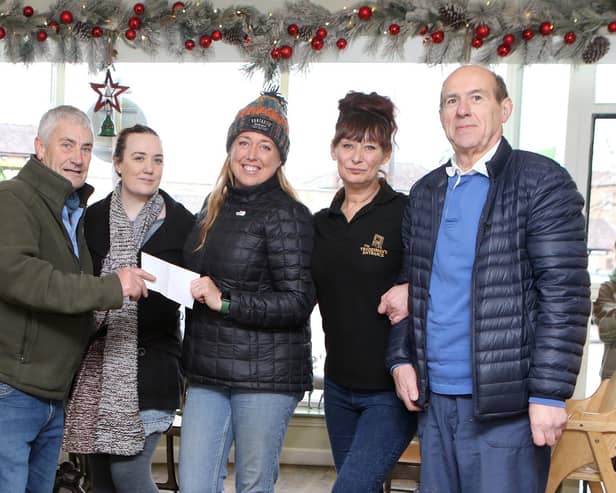 Martin Hoban and Henry Kukiewicz, Master and Secretary of the Phoenix Lodge of St Ann make a donation to kickstart this year's Christmas appeal at the Tradesman's Entrance. With Jojo Smith, Ruth Eyre and Caz Kidd
