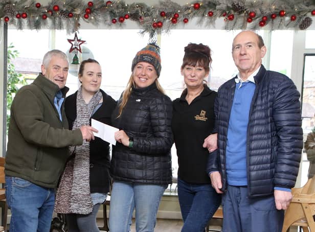 Martin Hoban and Henry Kukiewicz, Master and Secretary of the Phoenix Lodge of St Ann make a donation to kickstart this year's Christmas appeal at the Tradesman's Entrance. With Jojo Smith, Ruth Eyre and Caz Kidd