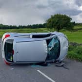 A Derbyshire woman failed the roadside breath test after flipping over her car.