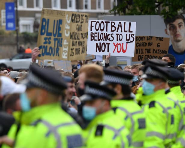 Police line up as Chelsea fans protest against the newly proposed European Super League prior to the Premier League match between Chelsea and Brighton & Hove Albion at Stamford Bridge. (Photo by Mike Hewitt/Getty Images)