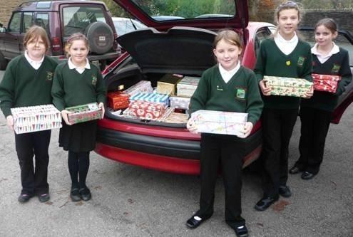 Pupils from St James' Primary School in Kettleshulme  sent 52 gift-filled shoeboxes to support disadvantaged children in 2011. Photo contributed.