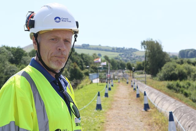 Dilwyn Parry, engineer for the Canal & River Trust, on top of the dam at Toddbrook Reservoir.