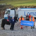 From left, Alfie Hall and Cracker the horse, Riding for the Disabled group chair Wendy Howe, Tarmac transport manager Heidi Sherwood, riding school owners Louise and Dave Thompson, Hazel Jones of Tarmac, and Lomas Distribution driver Tracy Dronfield-Boyd.