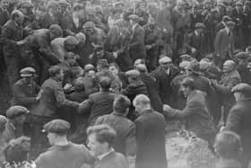 A game of Shrovetide football, ' kicked - off ' by the Prince of Wales in Ashbourne, is getting rather rough, in February 1928.