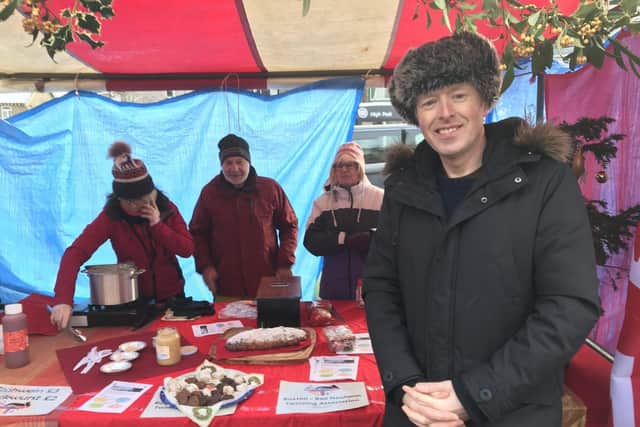 Members serving Gluewein and Bockwurst at the Buxton Christmas Market