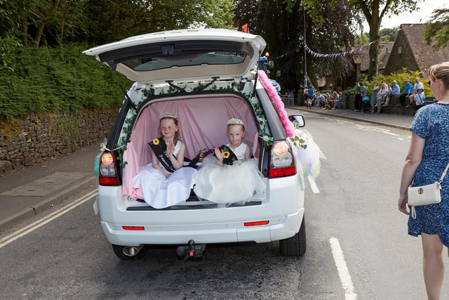 Two young carnival queens waving from their car. Pic Peter Cull Photography