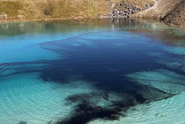 Police dye the waters of the blue lagoon near Buxton.