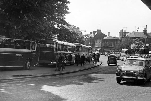 A thriving Buxton with shoppers and tourists filling Spring Gardens in 1965