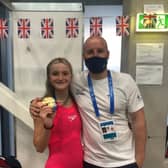 Abbie Wood shows off her second gold medal alongside coach Dave Hemmings in Budapest. She has two more individual events later this week. (Photo courtesy of Dave Hemmings)