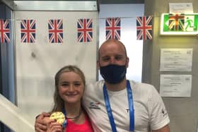 Abbie Wood shows off her second gold medal alongside coach Dave Hemmings in Budapest. She has two more individual events later this week. (Photo courtesy of Dave Hemmings)
