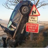The car was left on its end after the smash. (Photo: Derbyshire Rural Crime Team).