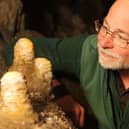 Pooles Cavern manager Alan Walker with some of the stalagmites that have been growing undisturbed during lockdown