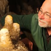 Pooles Cavern manager Alan Walker with some of the stalagmites that have been growing undisturbed during lockdown