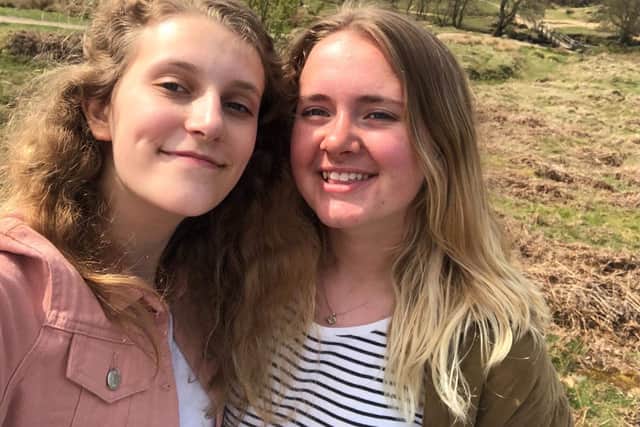 Buxton friends Annie Baldwin, left, and Abbie Ingleby are selling Christmas cards for three charities close to their hearts