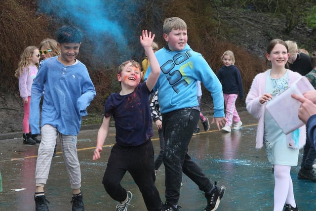 A blue cloud filled the air as pupils did laps of St Anne's playground for their fundraising colour run. Photo Jason Chadwick