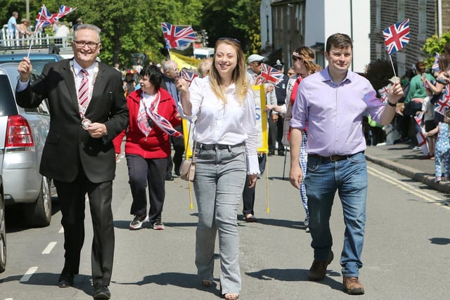 Whaley Bridge Town Council Chairman Mike Glover and Robert Largan MP along with his partner Beth lead off the Platinum Jubilee parade