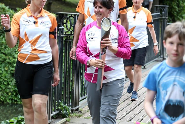 Baton bearer Joanne Lee holds the Queen's Baton during the Birmingham 2022 Queen's Baton Relay in Buxton