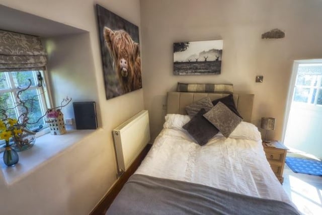 Villager Jim's best-selling photographs are showcased above the bed.