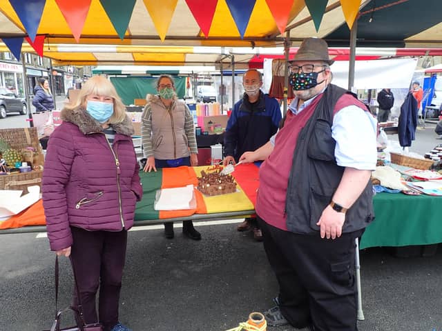 HPBC Leader, Cllr Anthony McKeown cuts the cake watched by (left to right): Cllr Jean Todd, Sarah Boardman and John Estruch.