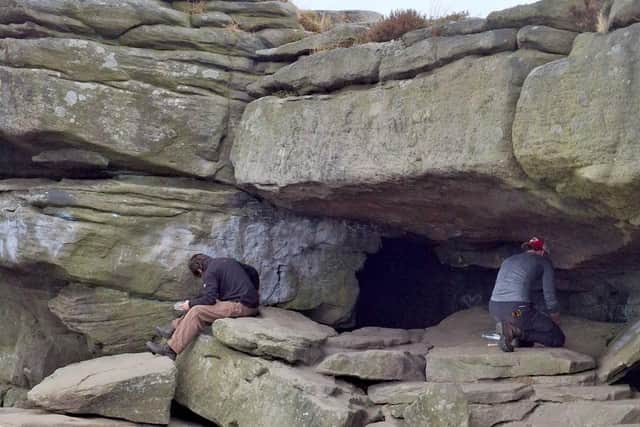 Volunteers worked carefully with special tools to remove the markings. (Photo: Peak District National Park Authority)