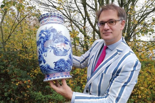 Charles Hanson with the rare Chinese vase he spotted under a table in someone's house