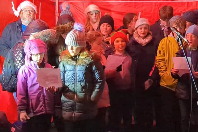 In fine voice at the New Mills lights switch on