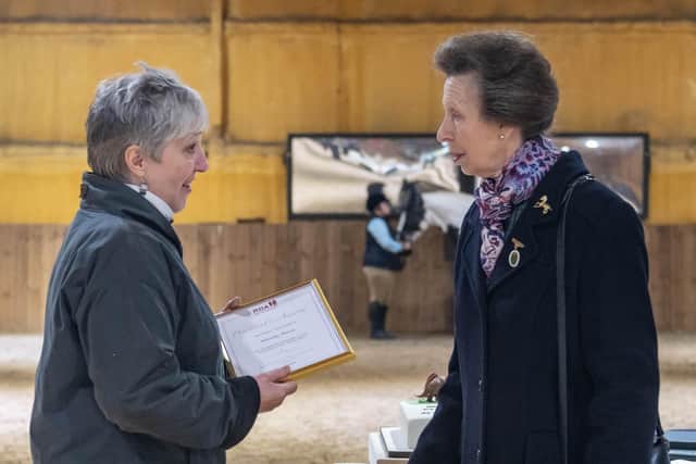 Wendy Howe, left, receiving the award from Princess Anne.
