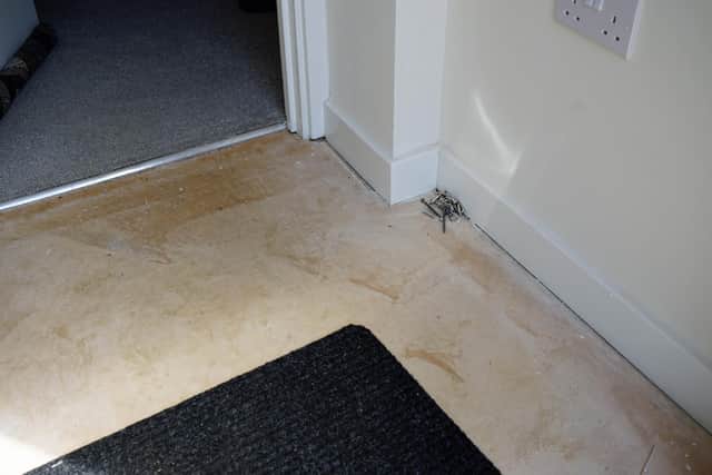 The flooded porchway which still has not been repaired. Photo Brian Eyre