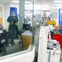 Medical staff wearing full PPE (personal protective equipment), including a face mask, long aprons, and gloves as a precautionary measure against COVID-19, work on an Intensive Care Unit (ICU) ward treating patients with COVID-19, at Frimley Park Hospital in Frimley, southwest England on May 22, 2020. - Britain's number of deaths "involving" the coronavirus has risen to 46,000, substantially higher than the 36,914 fatalities officially reported so far, according to a statistical update released Tuesday. (Photo by Steve Parsons / POOL / AFP) (Photo by STEVE PARSONS/POOL/AFP via Getty Images)