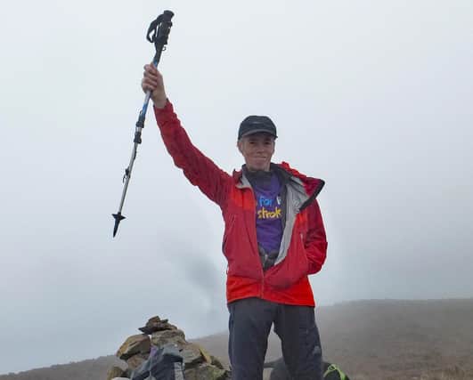 Top of the world feeling for Steve Bowker as he completes the 214 Wainwright Peaks climb in the Lake District.