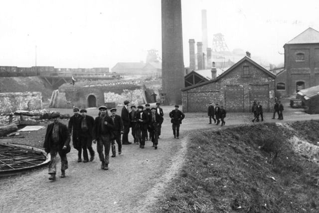 A group of coal miners leaving the mine in Derbyshire on 1st February 1912.