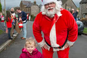 Two-year-old Olivia Thurlby meeting Santa