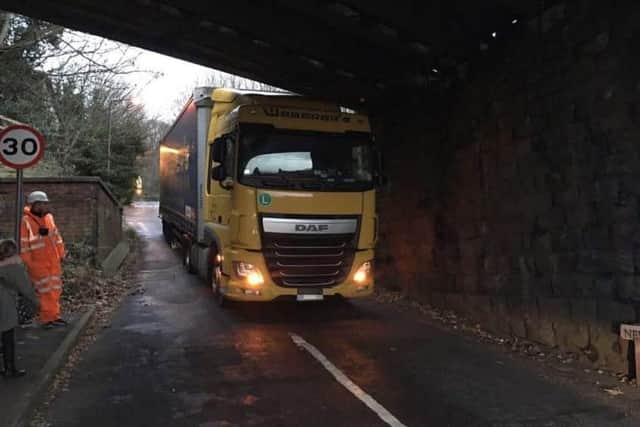 Lorry stuck under a bridge on Newbridge Road in Ambergate