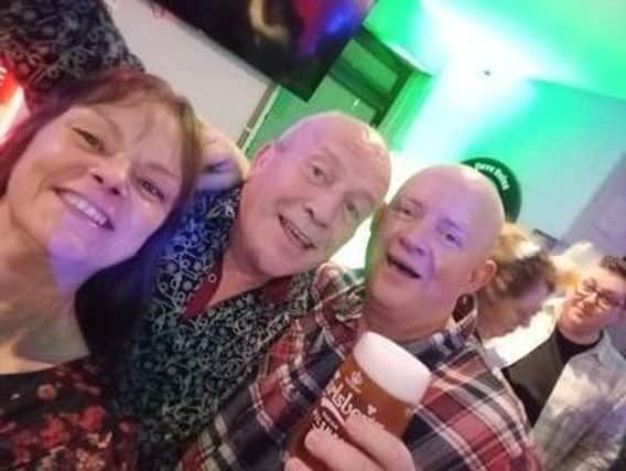 Raising a glass on a night out at Dove Holes Cricket Club. Photo Emma Bones