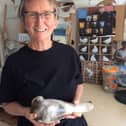 Ceramacist Vivienne Sillar with a pigeon she created during lockdown