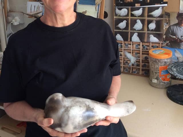 Ceramacist Vivienne Sillar with a pigeon she created during lockdown