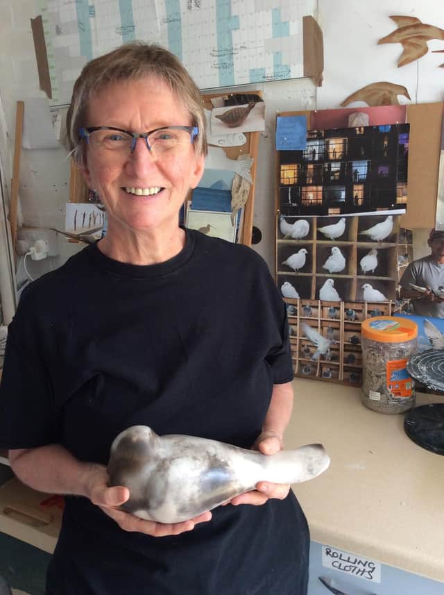 Ceramacist Vivienne Sillar with a pigeon she created during lockdown