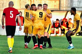 Reece Lyndon is congratulated after scoring the first goal. Photo by Fryerpix