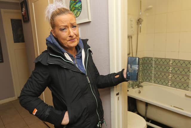 Rebecca Blunden in her wrecked flat which was flooded with human excrement